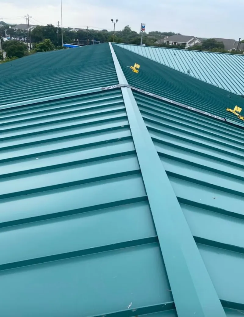 Green commercial metal roof ridge and valley for Metal Roof Repair in Harrietstown